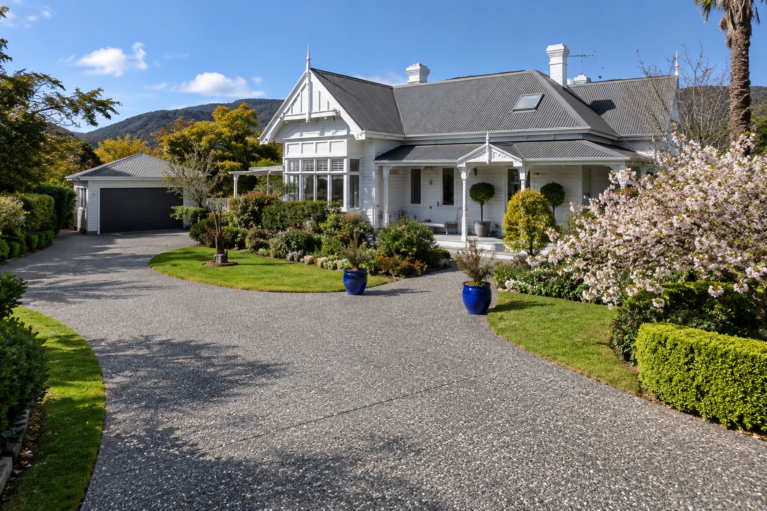 Curving pebble-finish aggregate driveway at a classic-style house, Cairns QLD